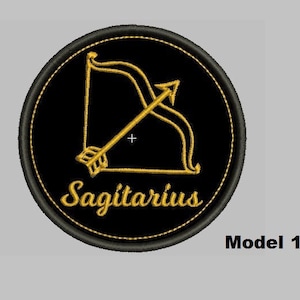 May include: Black and gold embroidered patch with the Sagittarius zodiac symbol, an arrow and bow, and the word "Sagittarius" in a script font.