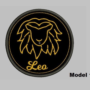 May include: Black and gold embroidered patch with a lion's head and the word "Leo" in a circle.