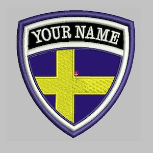 May include: A purple and yellow embroidered patch with a white border and the text "YOUR NAME" in black.