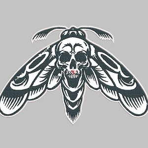 May include: Black and white illustration of a moth with a skull head. The moth has large wings with intricate details. The skull has a toothy grin.