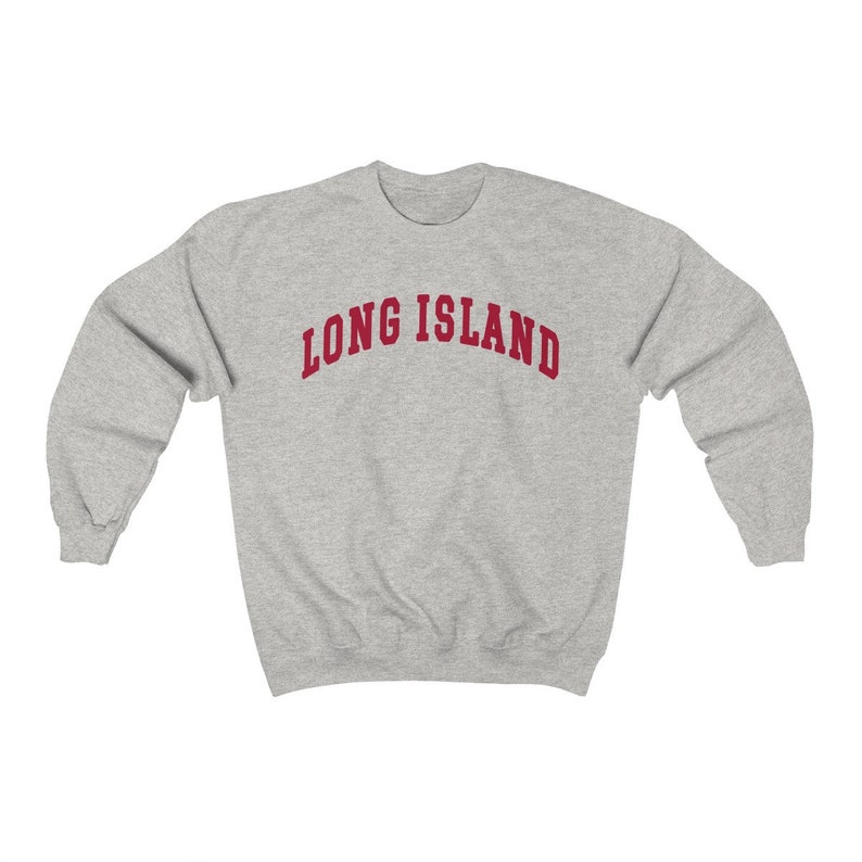 May include: A gray sweatshirt with the text "LONG ISLAND" in red.
