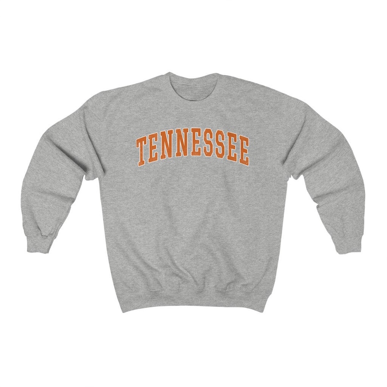 May include: A gray sweatshirt with the word "TENNESSEE" printed in orange on the front.