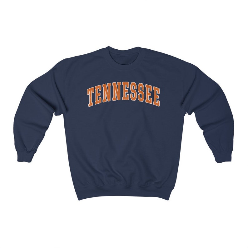 May include: Navy blue sweatshirt with the word "TENNESSEE" printed in orange on the front.