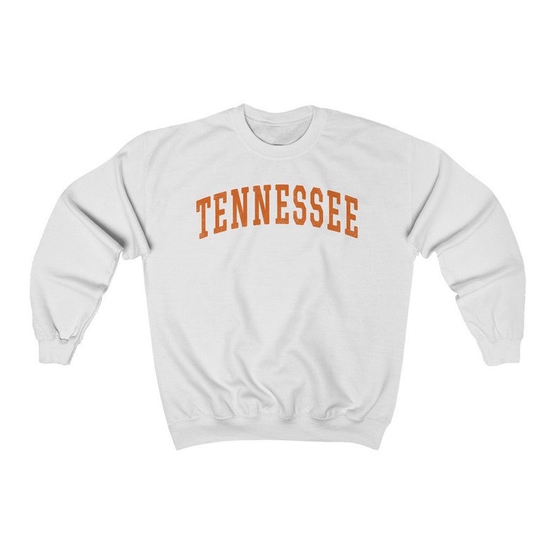 May include: White sweatshirt with the word "TENNESSEE" printed in orange on the front.