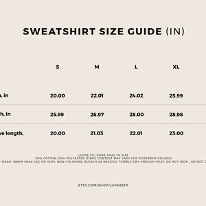 May include: A size chart for a sweatshirt in inches. The chart shows the width, length, and sleeve length for sizes S, M, L, XL, and 2XL. The chart also includes care instructions for the sweatshirt.