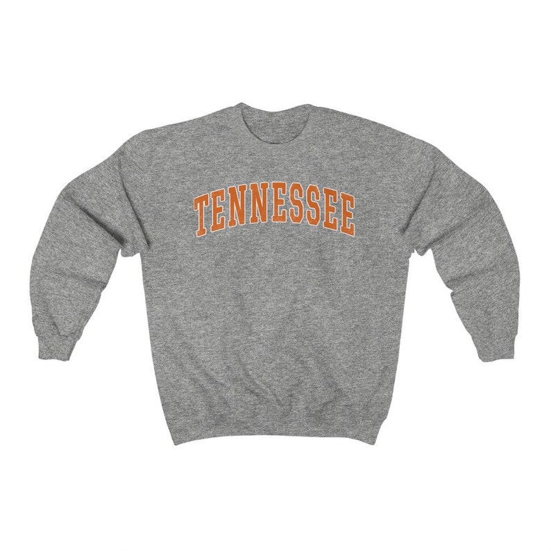 May include: A gray sweatshirt with the word "TENNESSEE" printed in orange on the front.