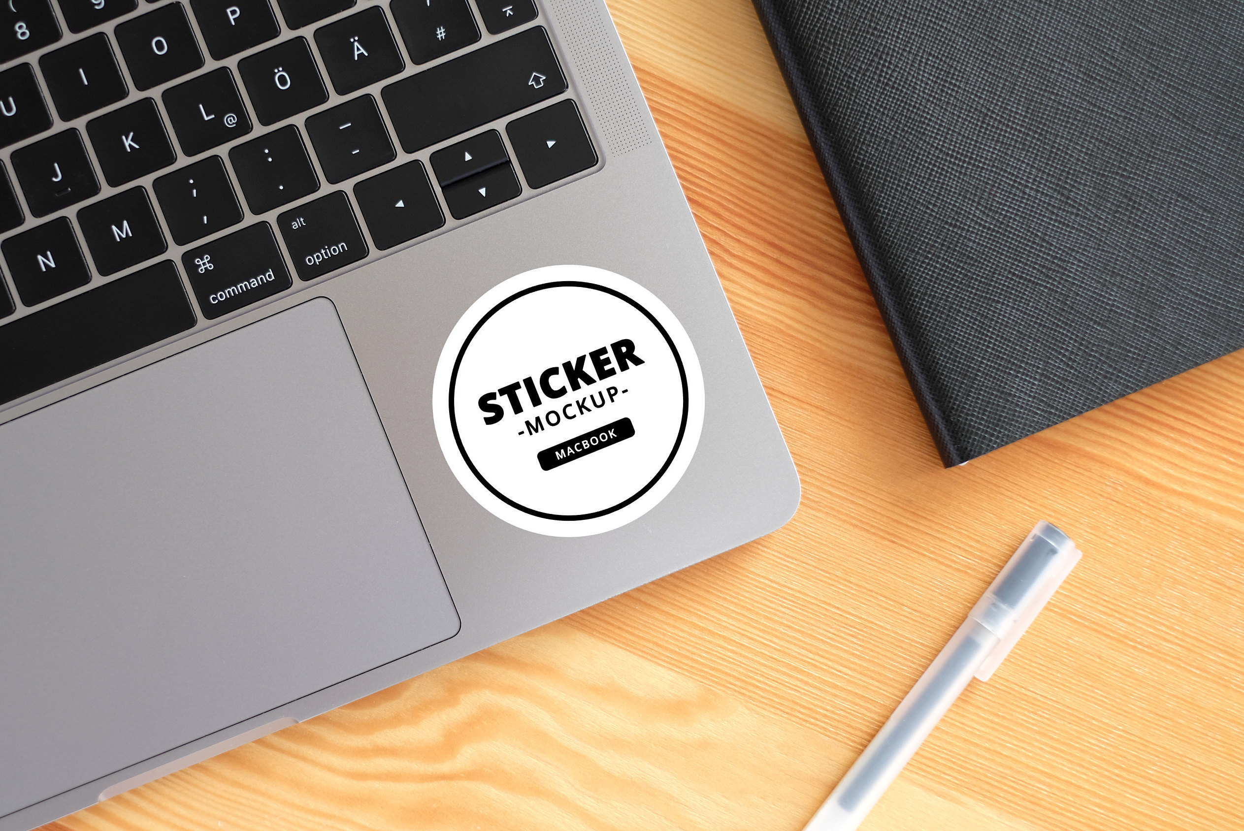 Free Sticker on Laptop Mockup (PSD)