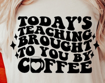 May include: A white t-shirt with a black graphic that says "Today's teaching brought to you by coffee" with a coffee cup icon.
