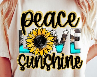 May include: A white t-shirt with a black graphic design that says "peace love sunshine" with a yellow sunflower in the middle.