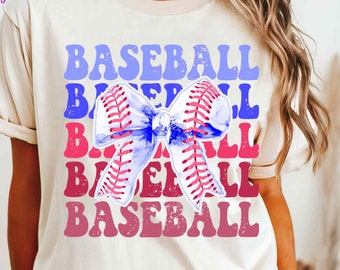 May include: A white t-shirt with a blue, pink, and red graphic design of the word "BASEBALL" repeated in a stacked pattern with a watercolor bow in the center. The bow is made of a baseball stitch pattern.