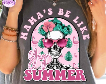 May include: Dark gray t-shirt with a graphic featuring a skull wearing pink sunglasses and a flower, with the text "Mama's Be Like Yay Summer". The design includes a pink flamingo and tropical leaf pattern.