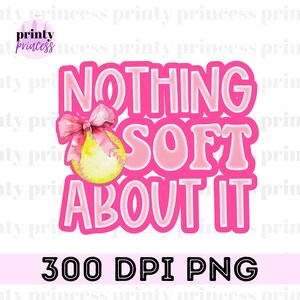 May include: Pink and yellow softball with a pink bow and the text "NOTHING SOFT ABOUT IT" in a pink outline.