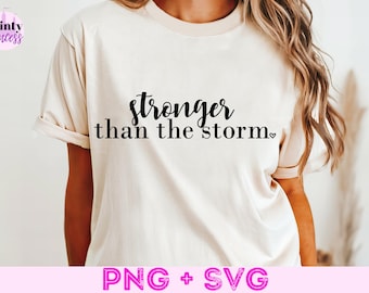 May include: A white t-shirt with the text "stronger than the storm" in black lettering and a small heart symbol.
