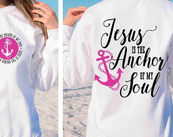 May include: White sweatshirt with a pink anchor and the text "Jesus is the Anchor of my Soul" on the back. The front of the sweatshirt has a pink anchor in a circle with the text "Jesus is the Anchor of my Soul" around the anchor.