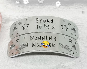 May include: Two silver shoe charms with engraved text. The top charm reads "Proud to be a" with a star on each side. The bottom charm reads "Running Walker" with a running shoe on each side and a laughing emoji in the middle.