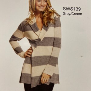 May include: A grey and cream striped cardigan with a wrap style and a hood. The cardigan is shown on a model. The text "SWS139 Grey/Cream" is visible in the image.