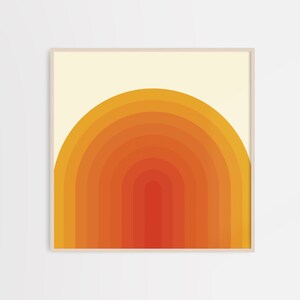 May include: A digital art print featuring a geometric design of concentric orange, yellow, and red semi-circles, resembling a sunset.