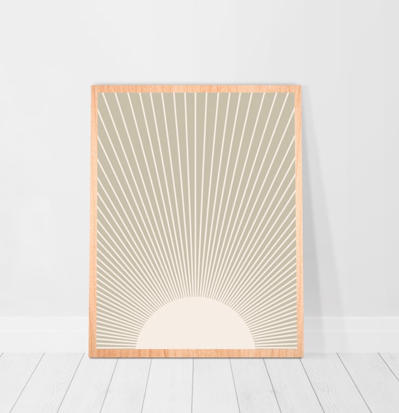Puede incluir: Una impresi&oacute;n enmarcada con un fondo beige y l&iacute;neas blancas que irradian desde el centro, formando un patr&oacute;n de sol naciente. El centro del sol naciente es un c&iacute;rculo blanco.