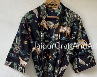 May include: Black cotton robe with a jungle print featuring leopards, birds, and palm trees. The robe has a tie belt and short sleeves.