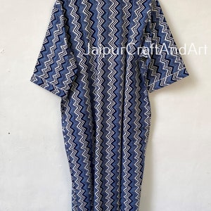 May include: A long blue and white cotton robe with a chevron pattern. The robe has a collar and three-quarter sleeves. The text "Jaipur CraftAndArt" is visible on the robe.