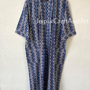 May include: A long blue and white patterned cotton robe with a white trim. The robe has a chevron pattern and is tied with a sash.