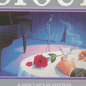 May include: A book cover with a gray background featuring the text "THE REX STOUT LIBRARY" in white. The title "REX STOUT" is in large white letters. The book cover features a black grand piano, a microphone on a stand, a red rose, a martini glass, and a hand holding a cigarette. The text "A NERO WOLFE MYSTERY" is in white letters on a gray background. The title of the book is "A FAMILY AFFAIR" in white letters on a gray background. The text "INTRODUCTION BY THOMAS GIFFORD" is in white letters on a blue background.
