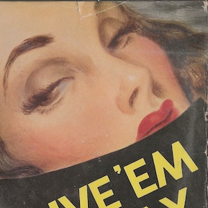 May include: A book cover with a woman's face partially obscured by a black axe. The title of the book is "Give 'Em the Ax" by A.A. Fair. The book is part of the Triangle Books series.