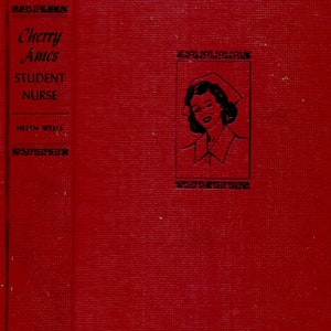 May include: A red book cover with the title "Cherry Ames Student Nurse" by Helen Wells. The cover features a black and white illustration of a woman wearing a nurse's uniform and cap.