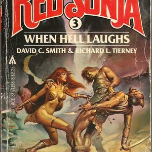 May include: Vintage paperback book cover for "Red Sonja: When Hell Laughs" by David C. Smith and Richard L. Tierney. The cover art features a warrior woman in gold armor fighting two men. The title is in red with a black background.