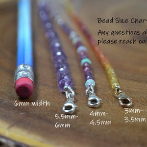 May include: A close-up of a wooden surface with a blue pencil and three beaded bracelets. The pencil's eraser is 6mm wide. The bracelets have various bead sizes, ranging from 3mm to 6mm. Text on the image reads "Bead Size Chart."
