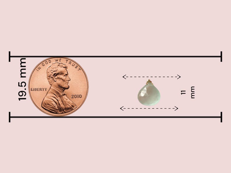 May include: A light green teardrop-shaped gemstone pendant with a gold bail. The pendant is 11 mm wide and 19.5 mm tall, as shown next to a US penny for size comparison.
