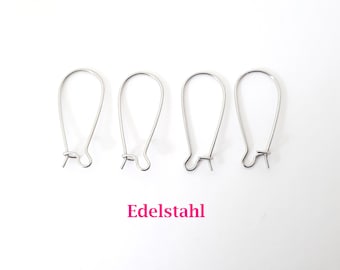 May include: Four silver earring hooks, also known as French hooks, are arranged in a row on a white background. The text "Edelstahl" is printed below the hooks.