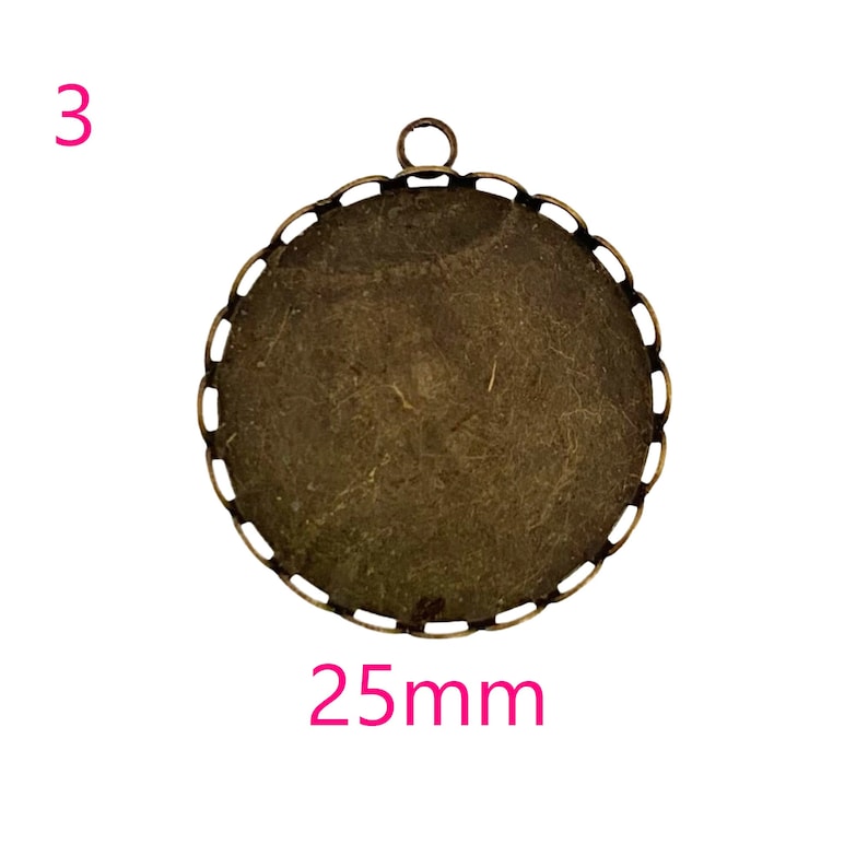 May include: A 25mm round metal pendant tray with a scalloped edge and a loop at the top. The tray is antique brass in color.