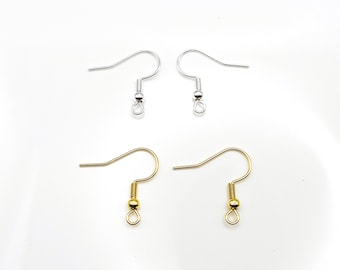 May include: Four earring hooks, two silver and two gold. The hooks are made of metal and have a small ball at the end.