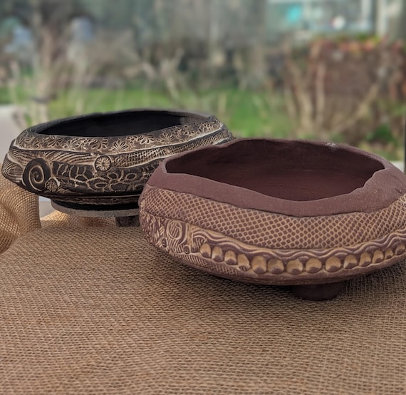 Ethnic embossed designed shallow garden pots.