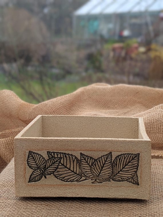 Leaf design stoneware garden pot.