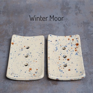 Winter Moor is a cream colour with speckles of blue and brown.