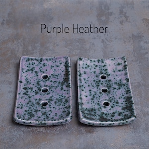 Purple Heather is a mauve with black speckles, varying in intensity.