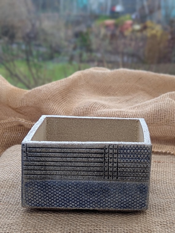 Square weatherproof stoneware garden pots. Available in several designs & colours.