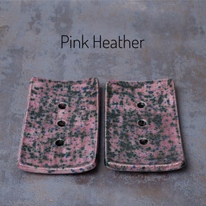 Pink Heather is a muted pink with black and blue speckles, varying in intensity.