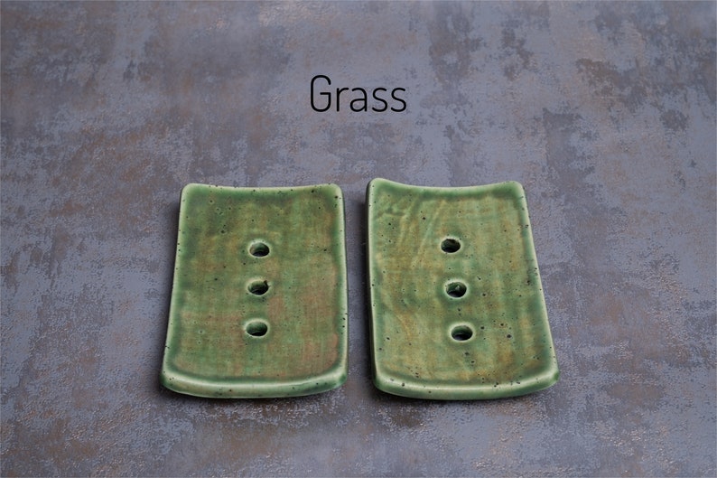 Grass has a mixture of greens and browns in varying intensities.