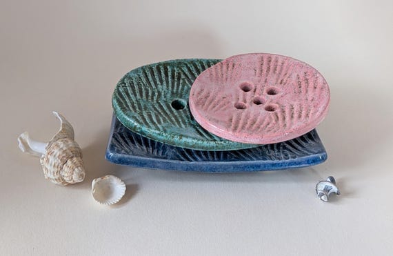 Ceramic Soap Dish with an embossed shells design.