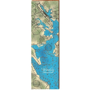 May include: A rectangular wooden sign featuring a nautical chart of Wareham, Massachusetts. The chart is in shades of blue and green, with depth markings and place names. The text "Wareham Massachusetts" is visible. The wood has a natural grain.