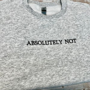 May include: A gray heather sweatshirt with the text "ABSOLUTELY NOT" embroidered in black.