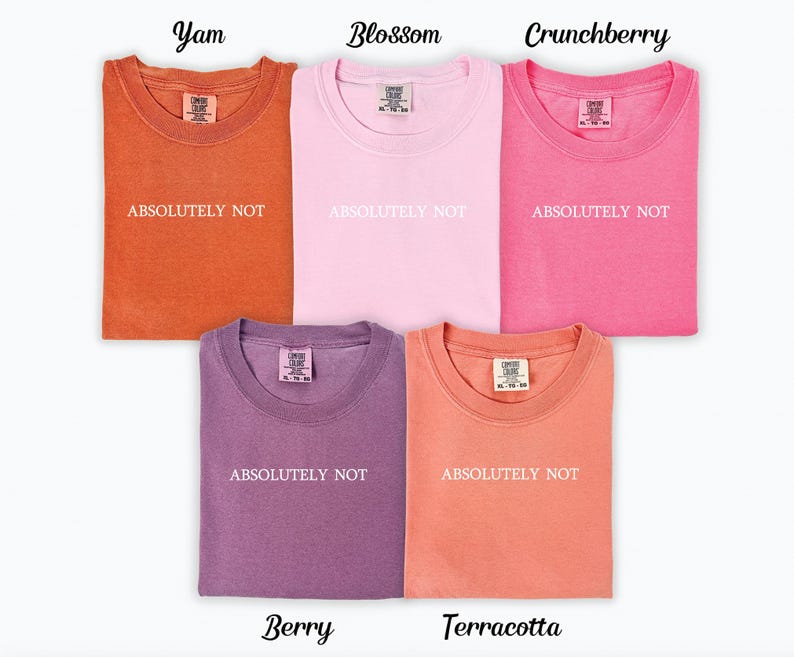 May include: Five t-shirts in different colours, each with the text "ABSOLUTELY NOT" printed on the front. The colours are: Yam (orange), Blossom (pink), Crunchberry (hot pink), Berry (purple), and Terracotta (coral).