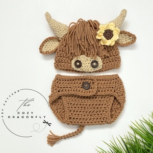 May include: A crocheted brown and cream highland cow costume for a baby. The costume includes a hat with a flower and a diaper cover with a tail.