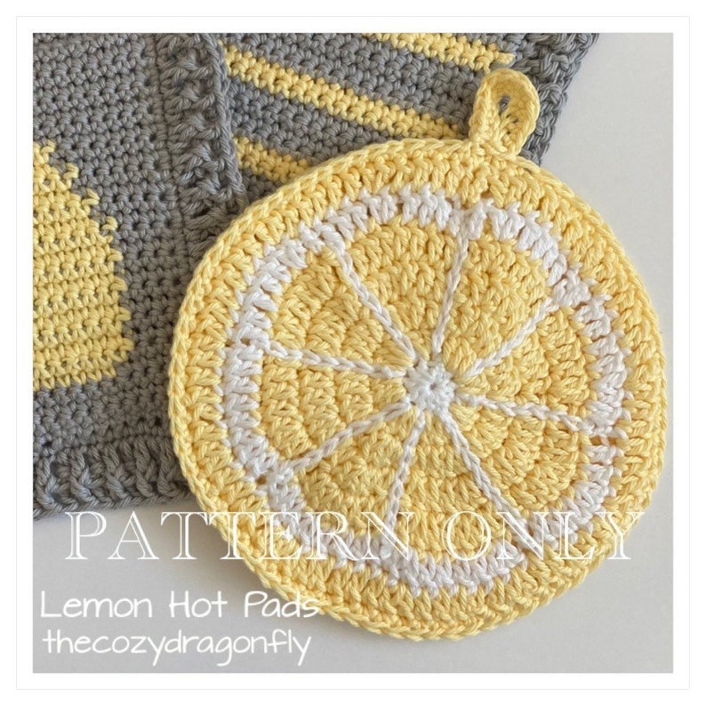 May include: A crochet lemon hot pad in yellow and white. The hot pad is shaped like a slice of lemon with a white center and yellow edges. The text "PATTERN ONLY Lemon Hot Pads thecozydragonfly" is visible in the image.
