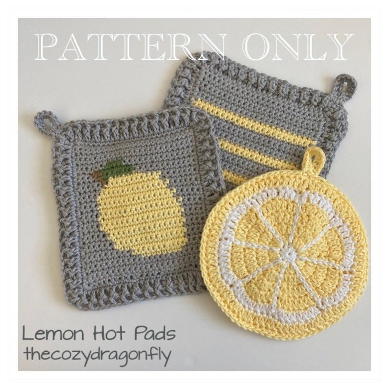 May include: Three crocheted lemon-themed hot pads. One is a gray square with a yellow lemon, another is a gray square with yellow stripes, and the third is a round yellow lemon slice.