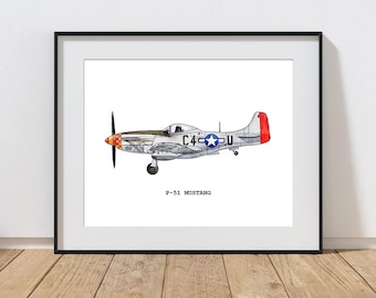 May include: Framed print of a P-51 Mustang airplane. The illustration features a silver body with red and blue accents, a black propeller, and the text "P-51 MUSTANG" below the image. The artwork is displayed in a black frame.