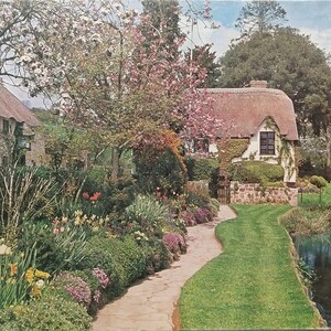 May include: A quaint cottage with a thatched roof sits beside a small river. The cottage is surrounded by a lush garden with blooming flowers and trees. A stone path leads from the cottage to the river.